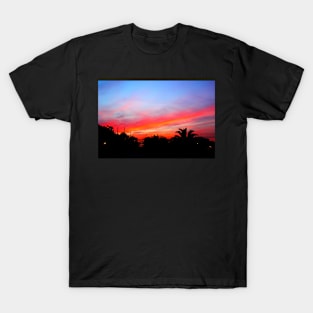 Stunning red purple sunset over a coastal town T-Shirt